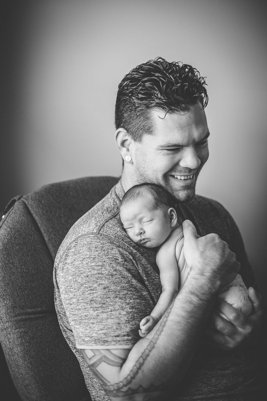 black and white image of daddy holding baby