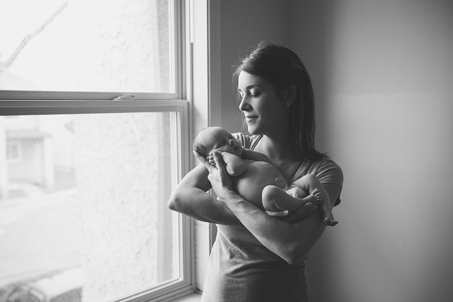 mommy holding newborn daughter