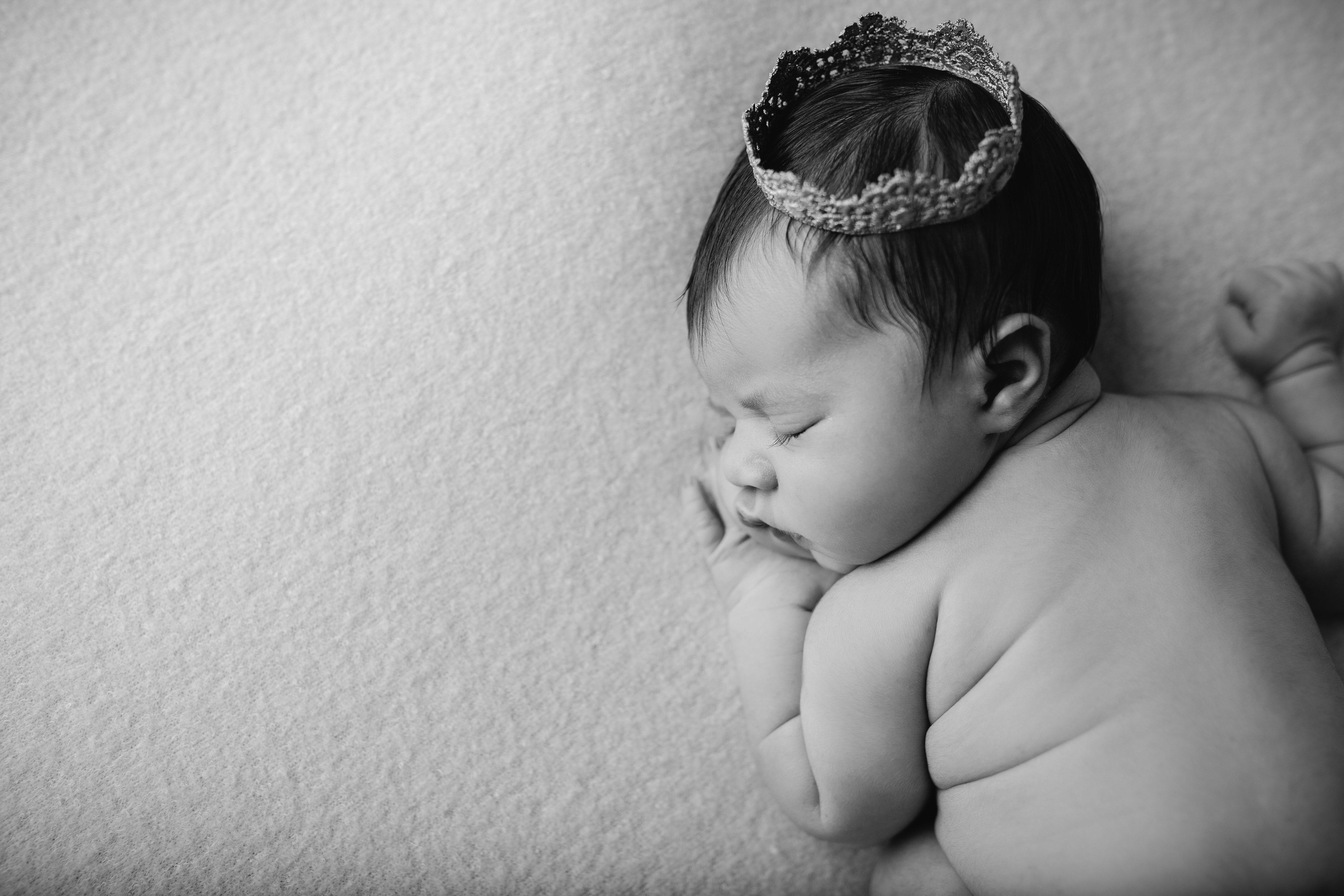 black and white of newborn with crown