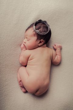 newborn posed with crown