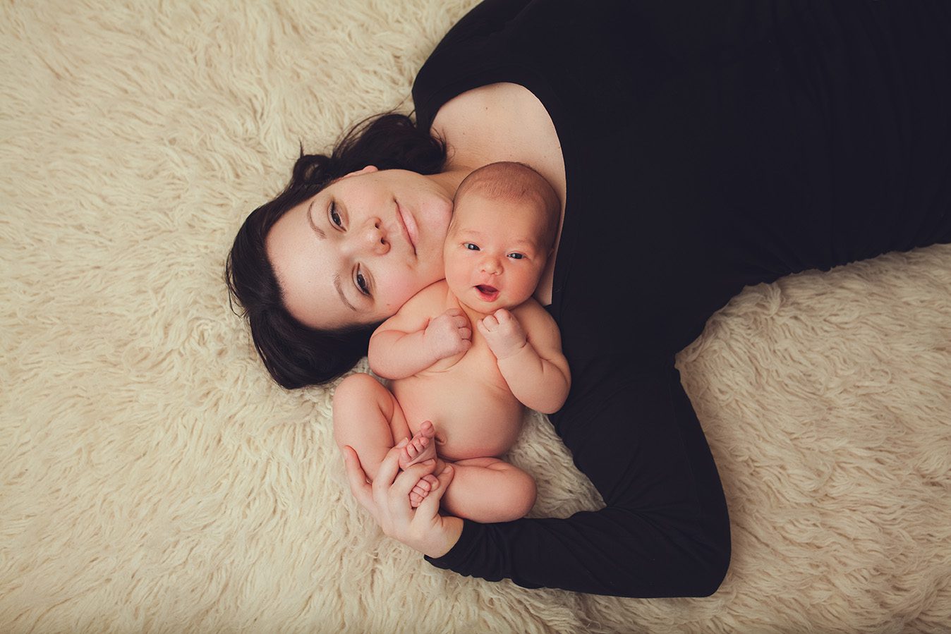 Edmonton newborn photographer - posed with mommy on back